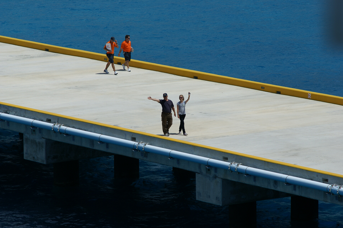 Jim and Kellie walking down a concrete pier