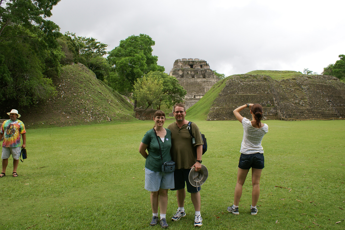James and Julie pose with a large stone pyramid in the background