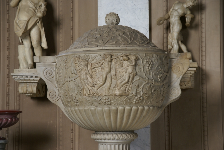 A highly detailed marble bowl with images of people harvesting grapes on sides and lid