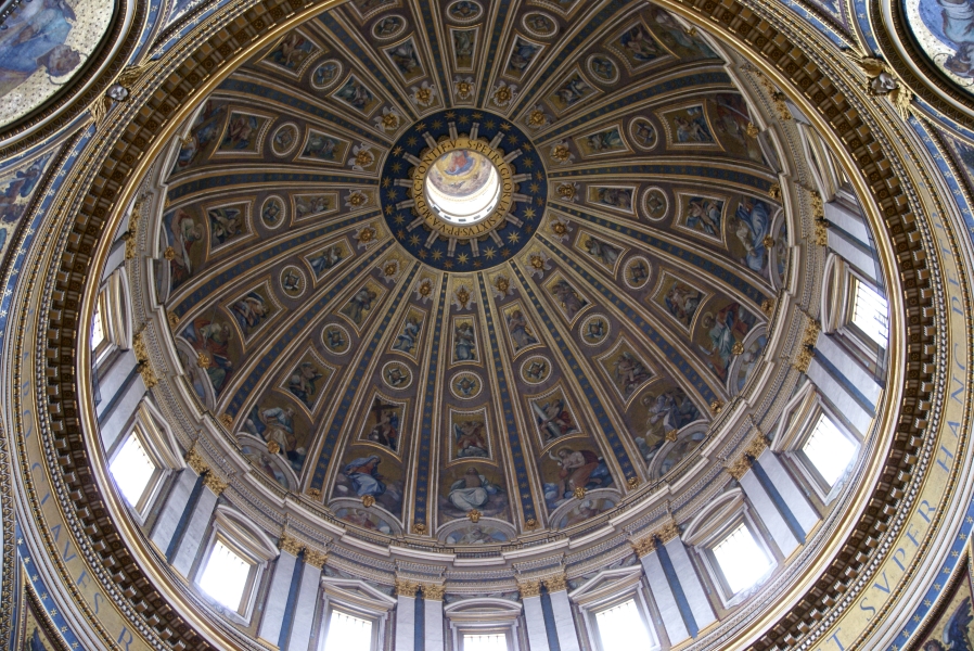 A large dome is separated in to 16 wedges painted in gold and blue accents with images of saits and angels