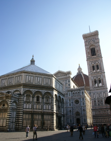 Early morning sun shines through a cloudless sky on the baptistry, cathedral and bell tower in Florence