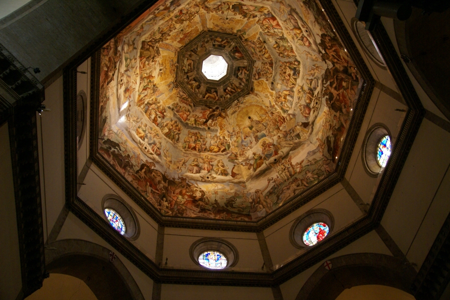 Five rings of detailed painted scenes from the bible decorate the interior of the dome above eight round stained glass windows