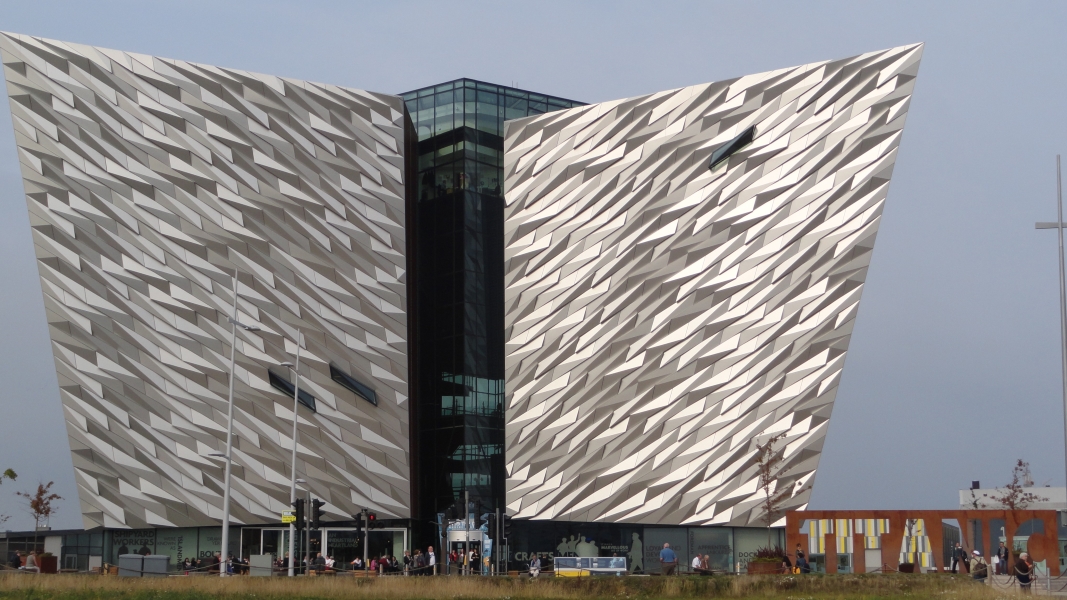Silver walls form 4 pointed corners of a multi-story building