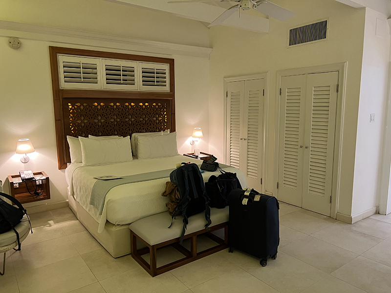 Other side of hotel room with bed and closets