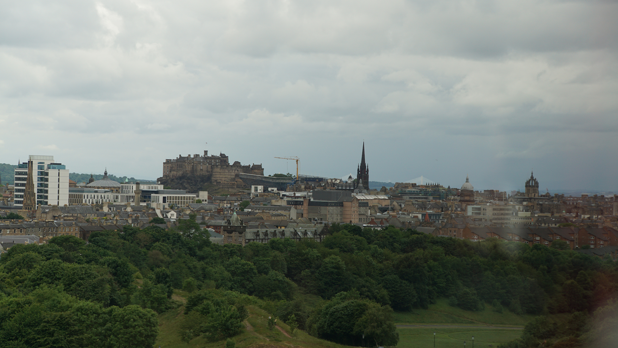 Castle in distance on hill above city below