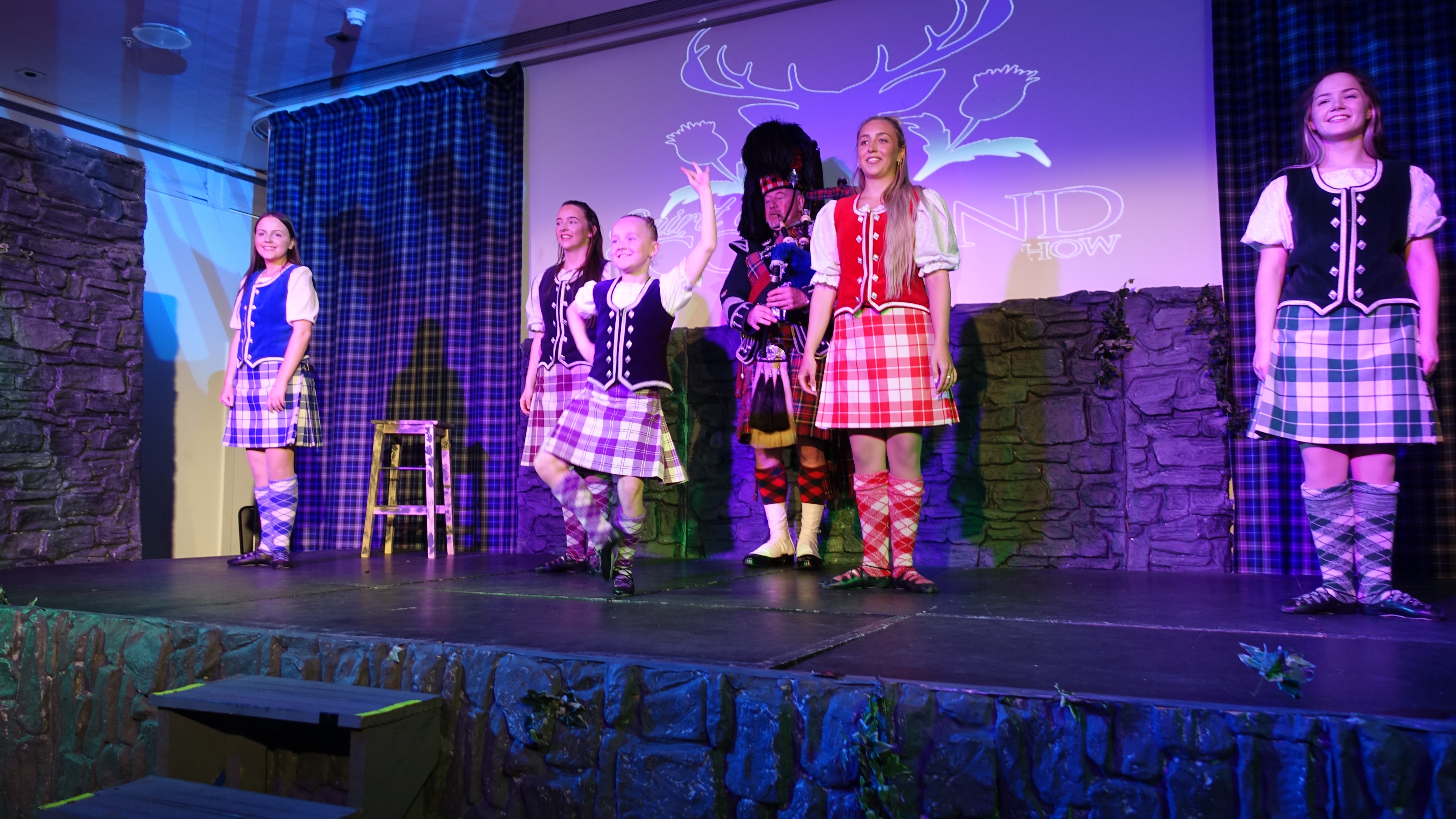 Dancers in colorful outfits on stage