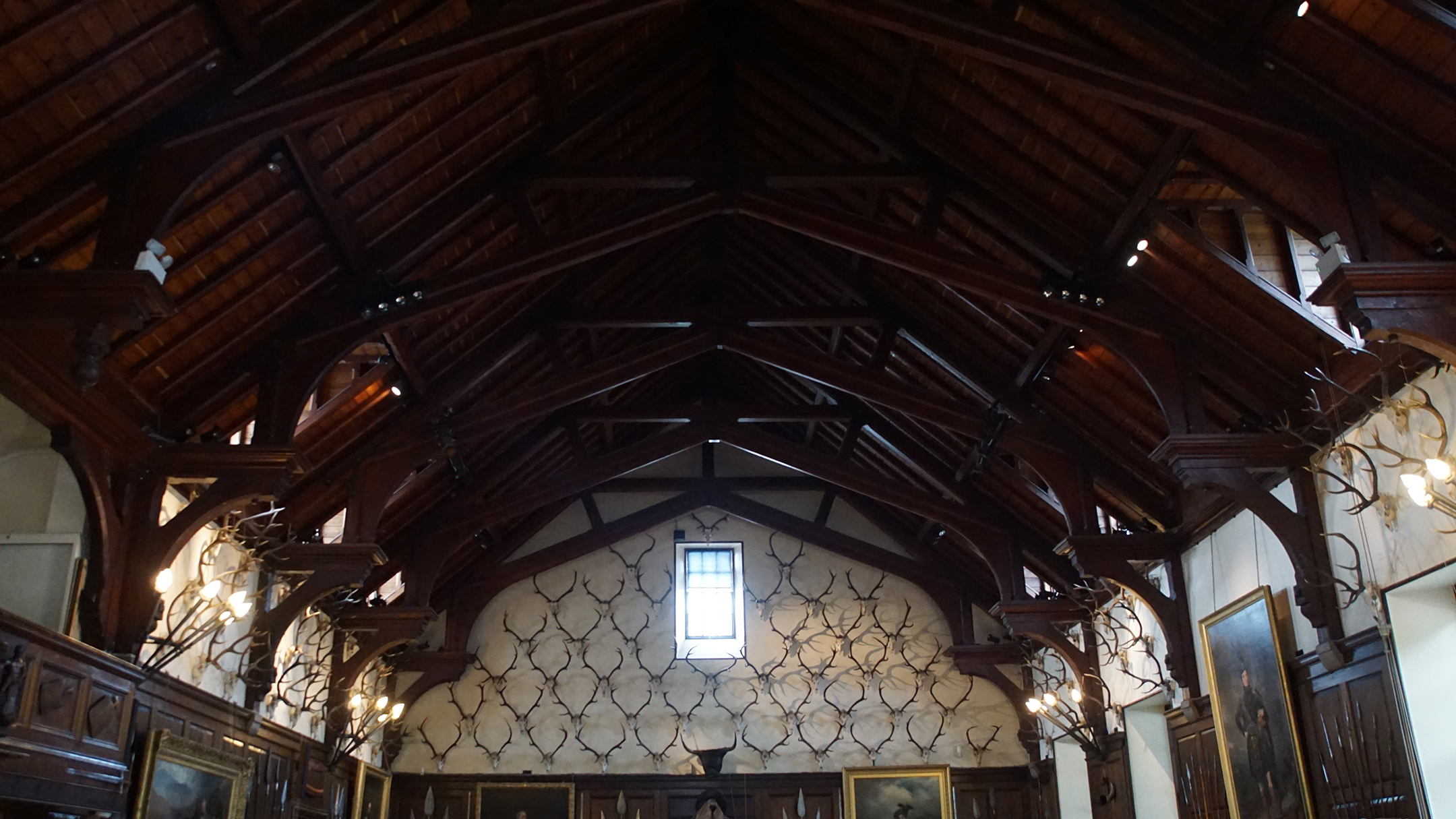 Antlers on the walls under a wood beamed roof