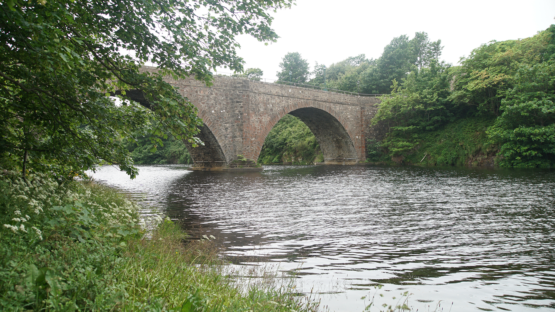 Stone arch bridge over a small river