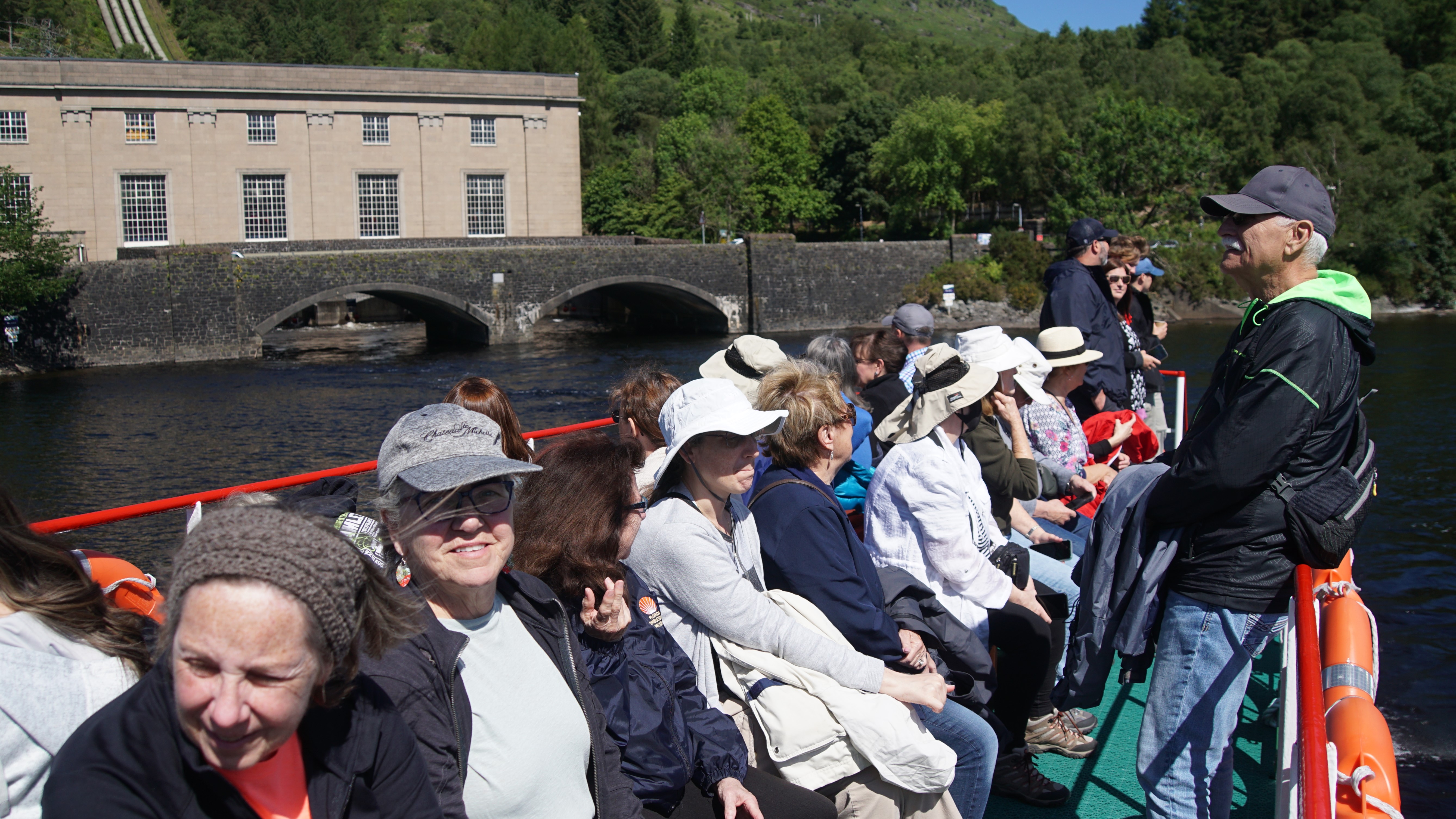 Group of people on the top deck of a boat