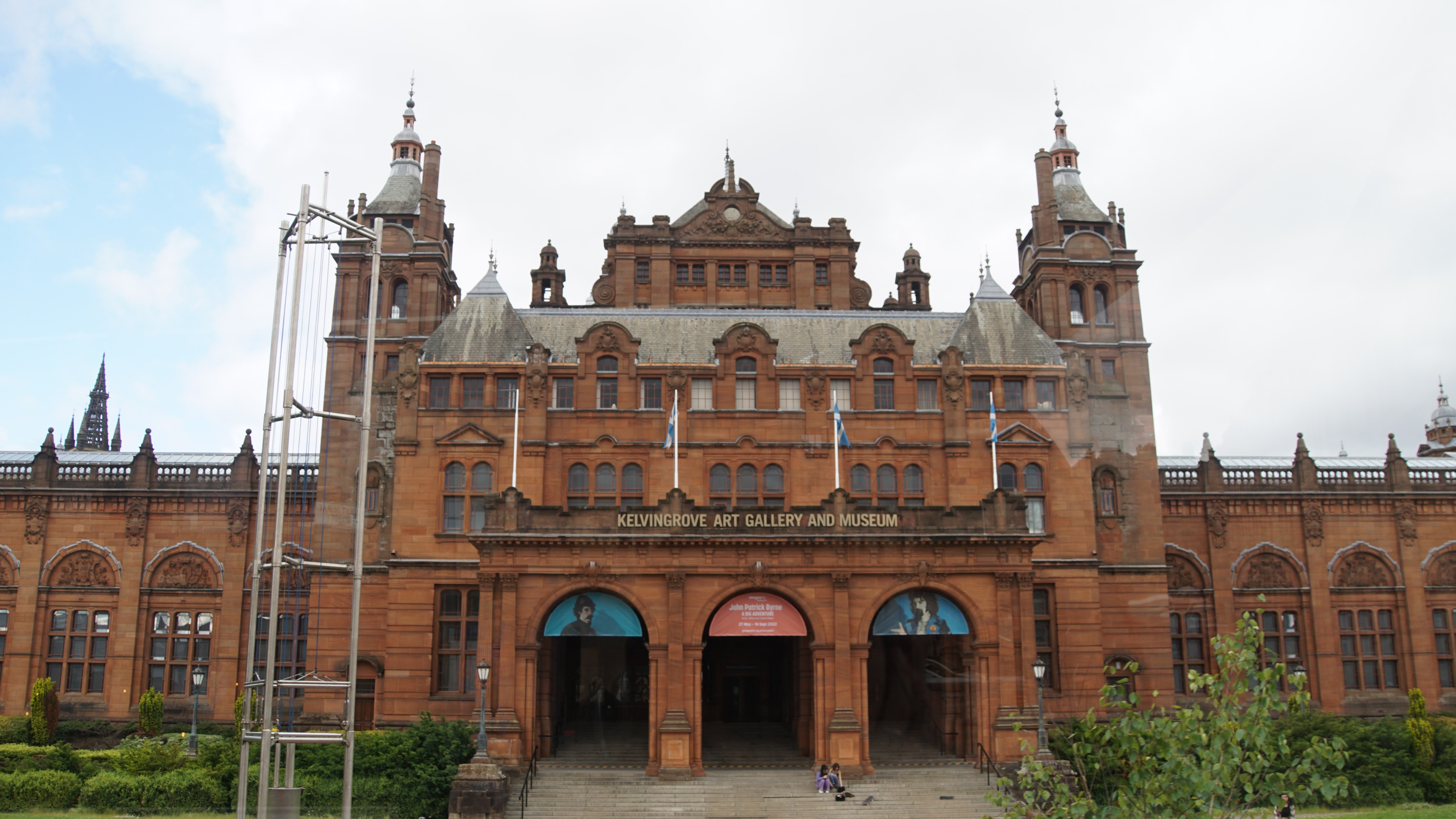 Historic red brick building with sign identifying it as a museum