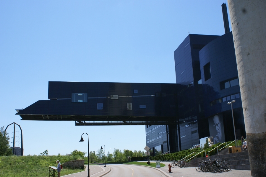 A black panel observation platform extends out over the road