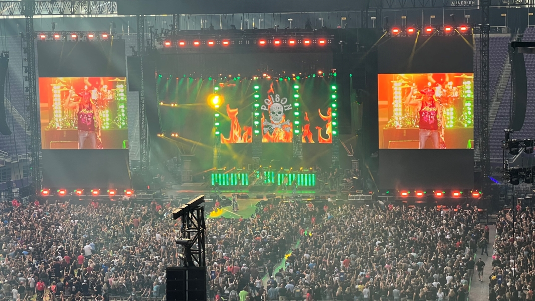 The crowd on the field filling in the seats in front of the stage