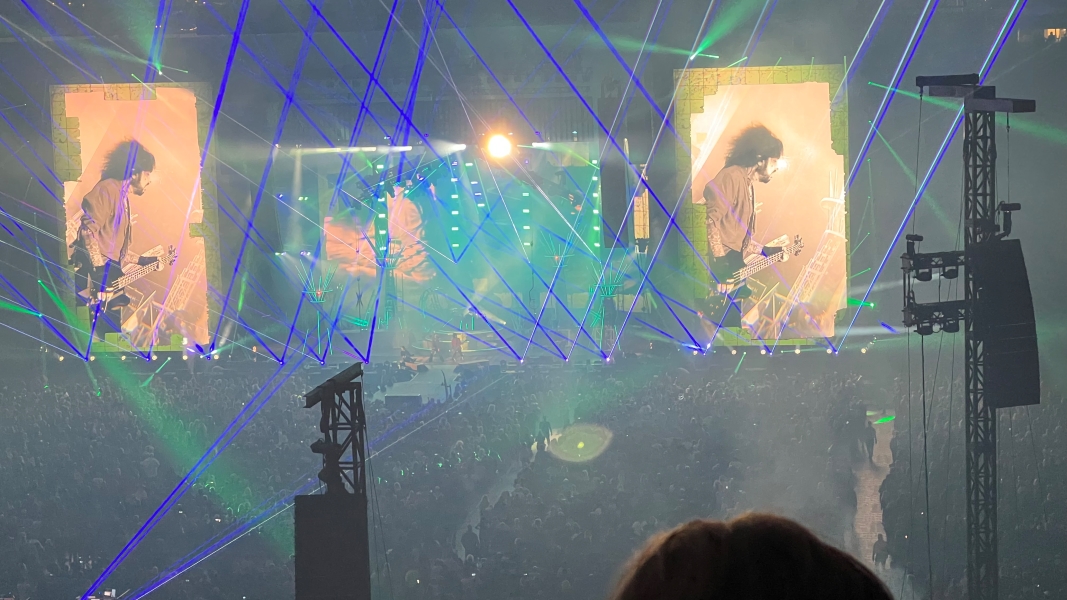 Lasers are visible from the stage in smoky air