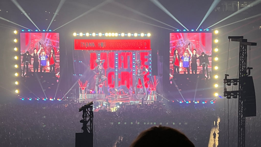 The display above the stage says Thank you Minneapolis as a band takes a bow